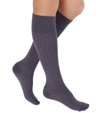 pair of gray knee high compression socks with lighter gray polka dots